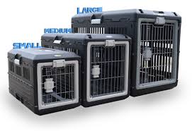Three heavy-duty charcoal and black airline cargo crates in small, medium, and large sizes